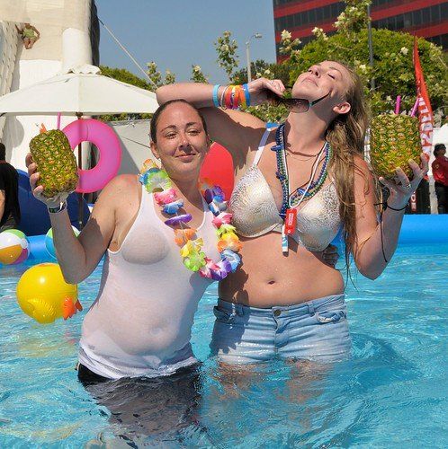 Busty lesbians by pool