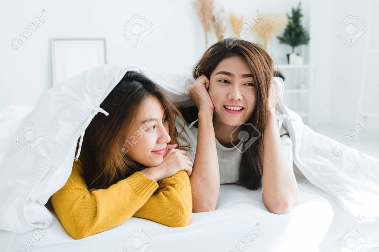 Lesbian and woman lying on woman