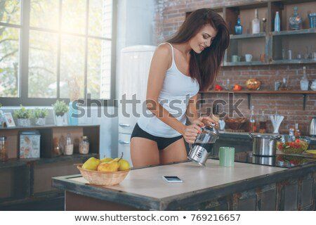 Sexy woman in kitchen